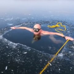 Freediver Glides Through Frozen Lake in Czech Republic Freediver Glides Through Frozen Lake in Czech Republic