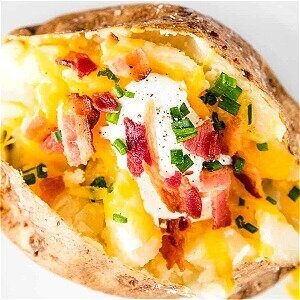 Martha Stewart's Go-To Move For Truly Delicious Baked Potatoes